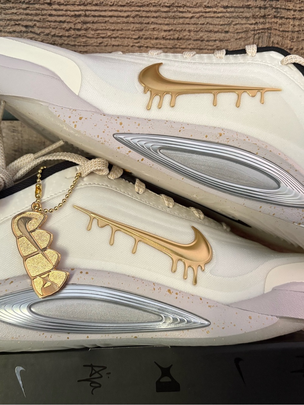 Nike A Ones: A’ja Wilson’s basketball White Sneakers with Gold Drip Swoosh Charm